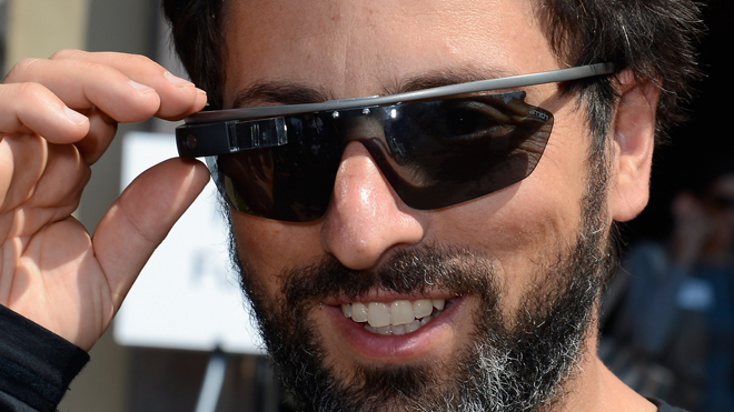 SUN VALLEY, ID - JULY 12: Google co-founder Sergey Brin (L) wears Project Glass prototype glasses at Allen & Company's Sun Valley Conference on July 12, 2012 in Sun Valley, Idaho. Since 1983, the investment firm Allen & Company has annually hosted the media and technology conference which is usually attended by powerful media executives. (Photo by Kevork Djansezian/Getty Images)